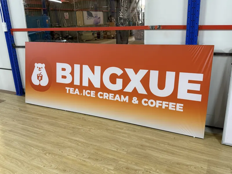 A printed signboard face for a tea and ice-cream shop, ready to be fitted.
